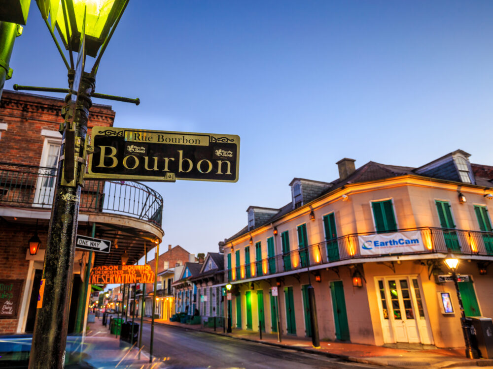 Neon signs on legendary bourbon street, one of the best parts to stay in New Orleans