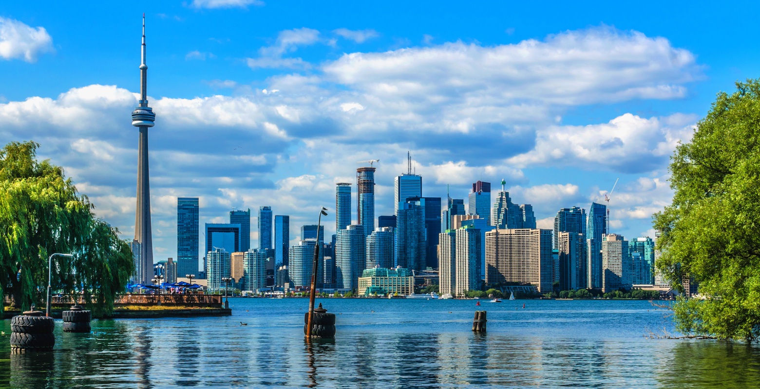 For a piece on where to stay in Toronto, a skyline looms large over a lake