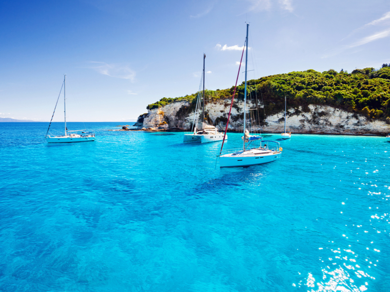 Sailboats in Paxos Island Bay during Summer, the best time to visit Greece