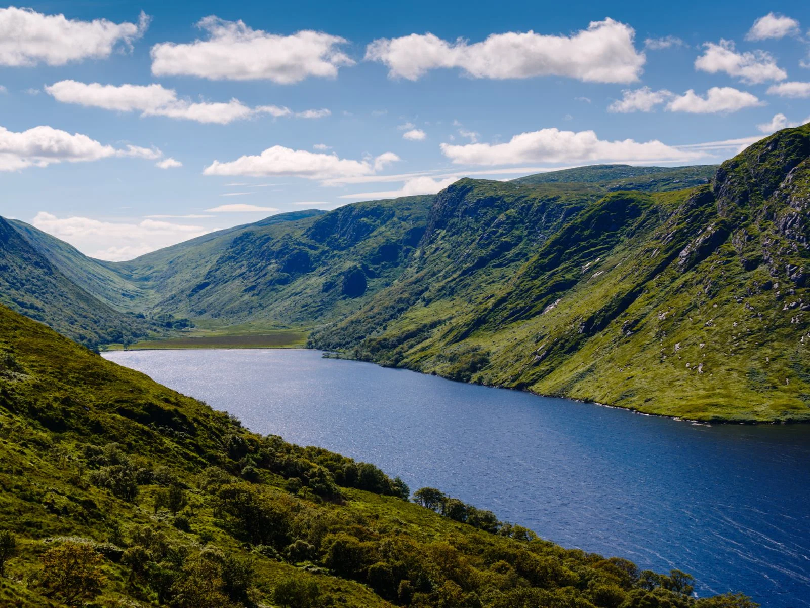 Aerial view on the calm Glenveagh lake at Glenveagh National Park, a piece on the best places to visit in Ireland