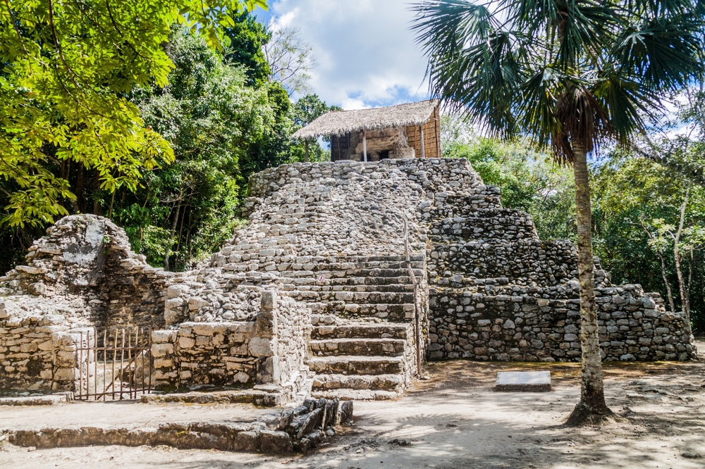 Pyramid of the Painted Lintel at Coba, showcasing one of the best Mayan ruins in Mexico amid green trees and walking paths for a things to consider section