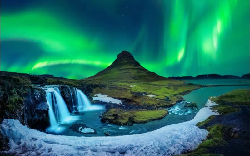 Northern Lights as viewed from a mountain at Kirkjufell