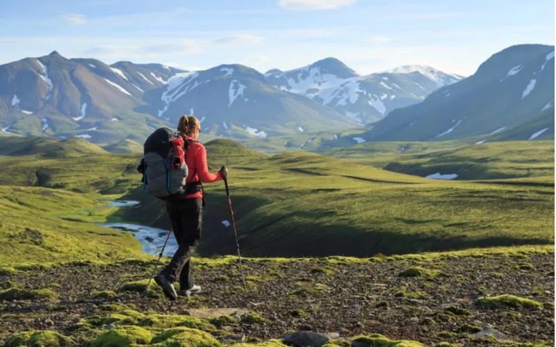 Post on Things to Do in Iceland depicting a woman hiking in the beautiful mountains