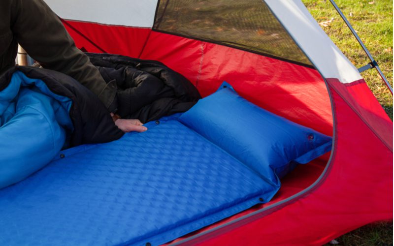 The best camping air mattress laid out in a tent