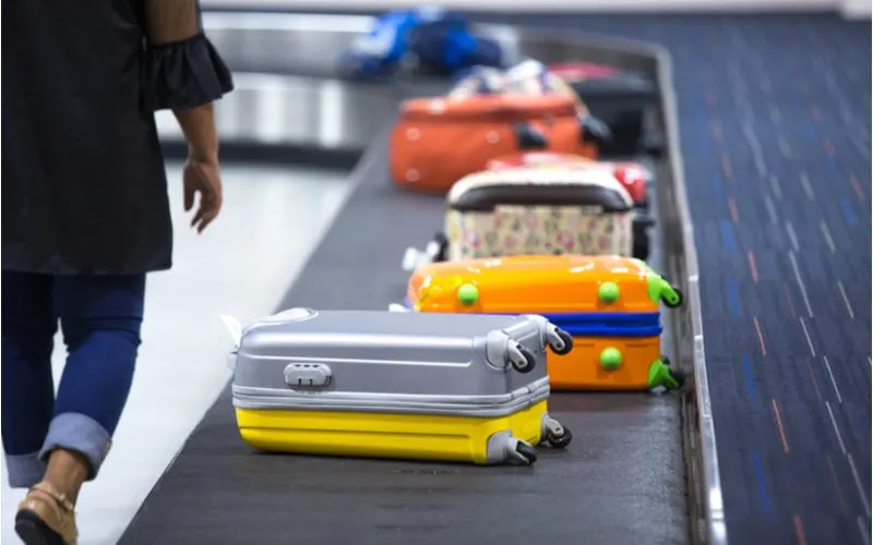 A bunch of suitcases that could benefit from using the best luggage tags
