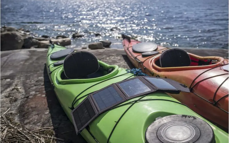 One of the best portable solar panels laying across a kayak
