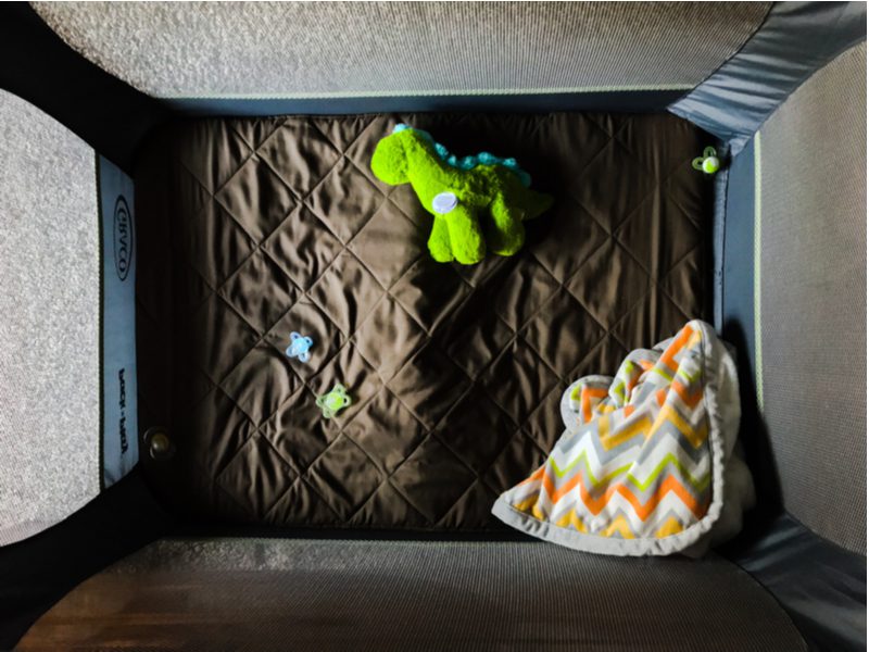 Pack n play for travel in a living room