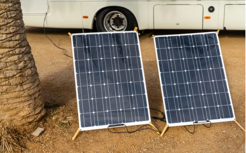 Best portable solar panels for RVs sitting next to a camper