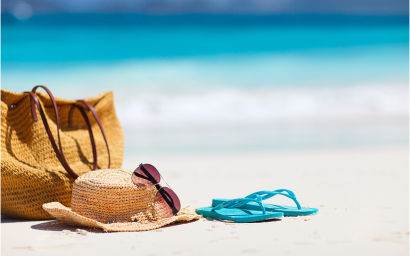 One of the best beach hats sitting on the sand by an ocean