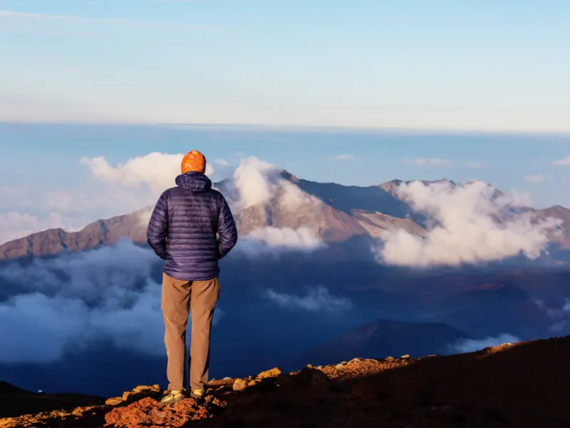 Guy hiking the Halaekala volcano, one of the best things to do in Hawaii