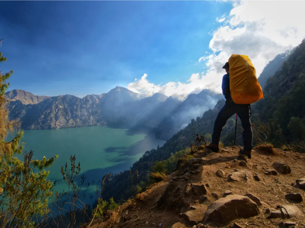 Man hiking one of the best hikes in the world, Mount Rinjani in indonesia