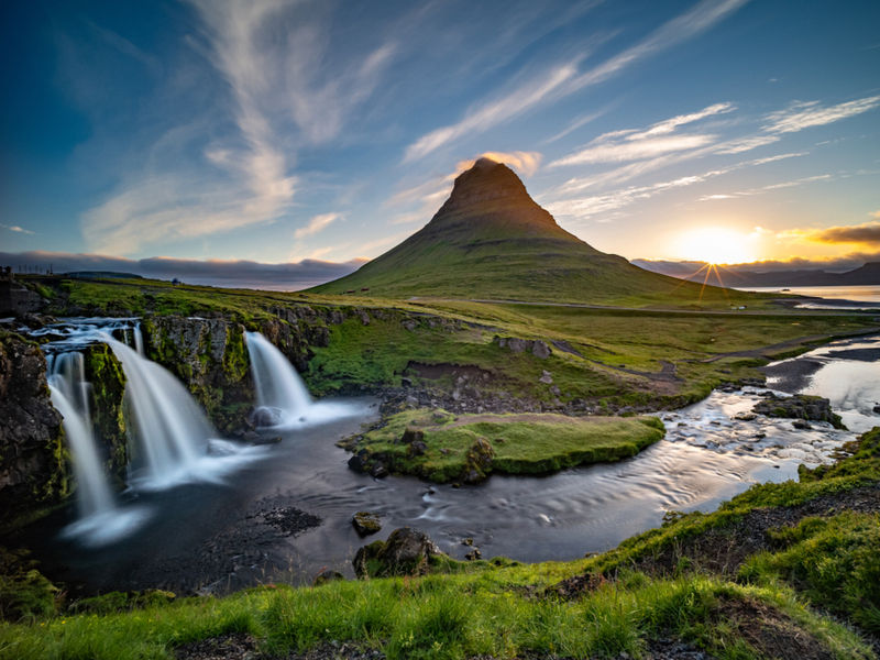 One of our top picks for where to stay in Iceland, Grundarfjordur, with waterfalls and mountains in the background