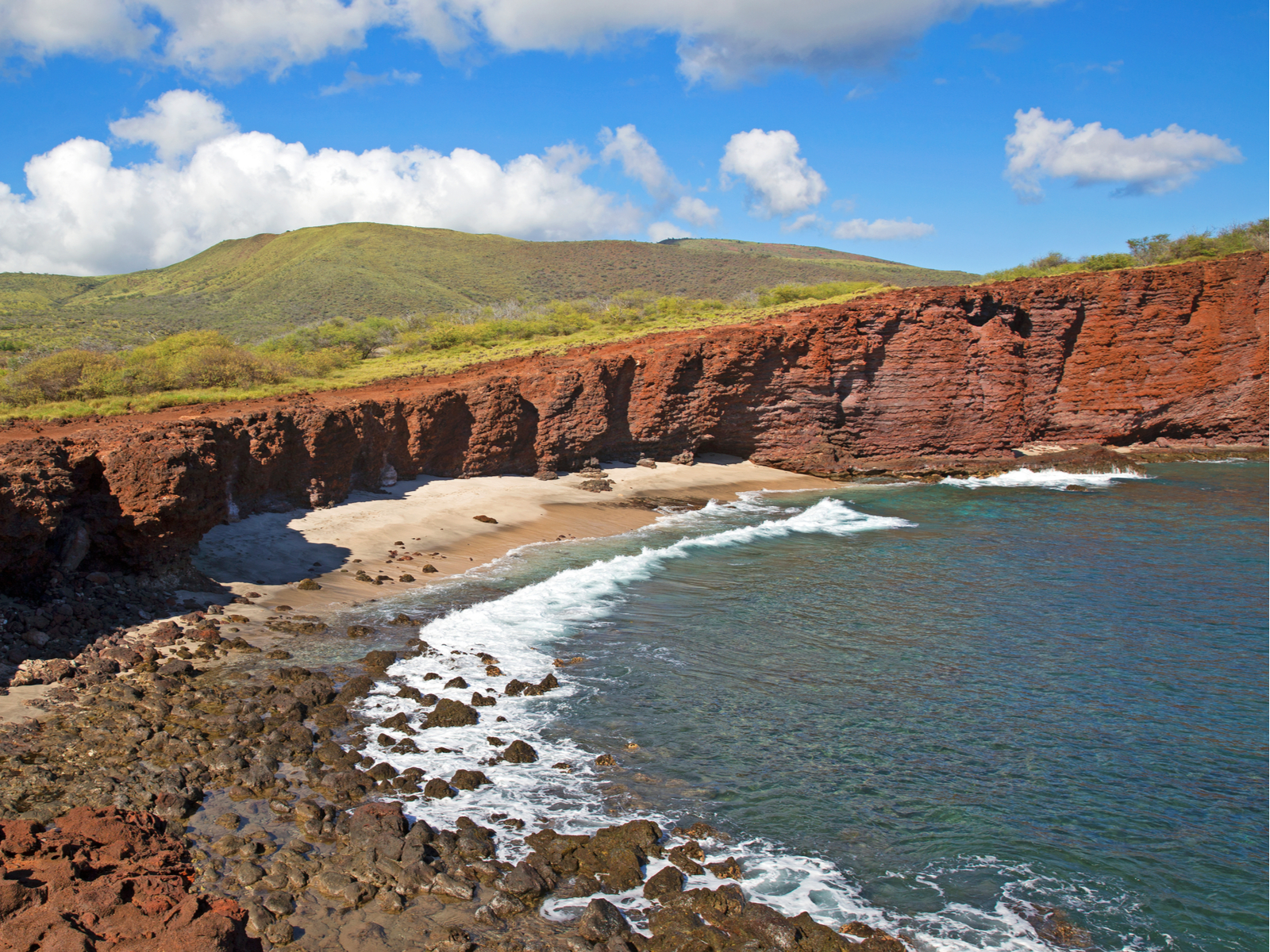 Puupehe, one of the best hikes in Hawaii, featuring the famous red cliffs