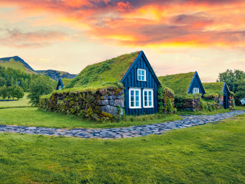 Neat turf houses in the countryside during the best time to visit Iceland