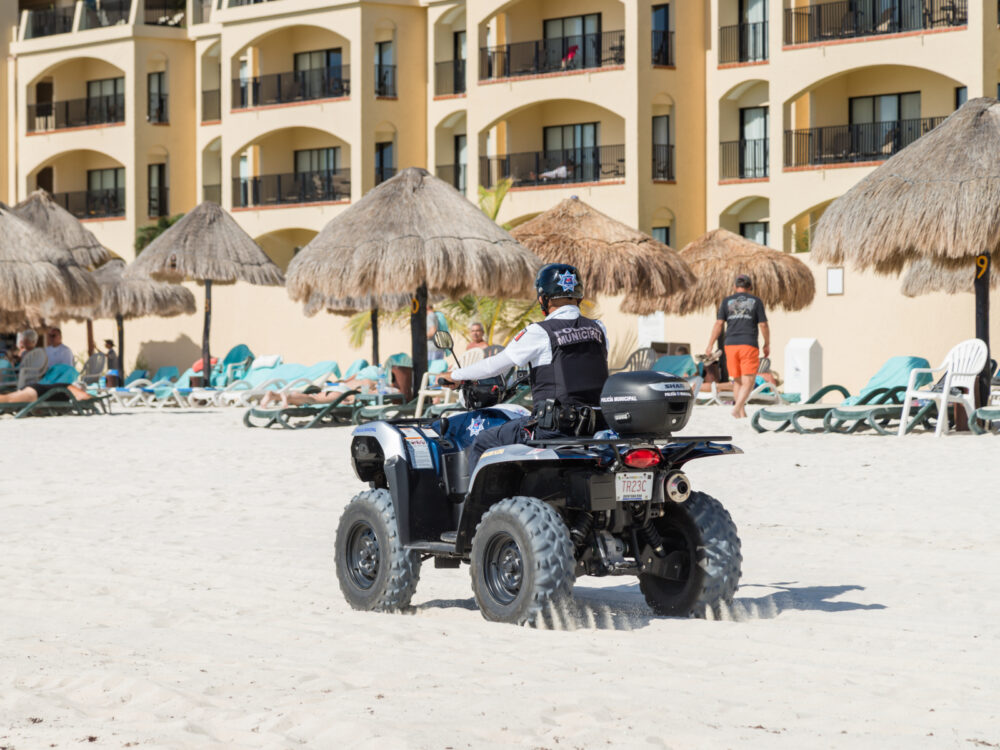 Armed guard on an ATV for a piece on Is Cancun Safe