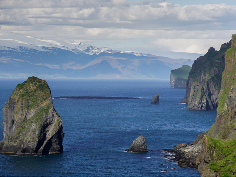 Vestmannaeyjar, one of the best parts of Iceland to stay in, as viewed from the coast with breathtaking scenery