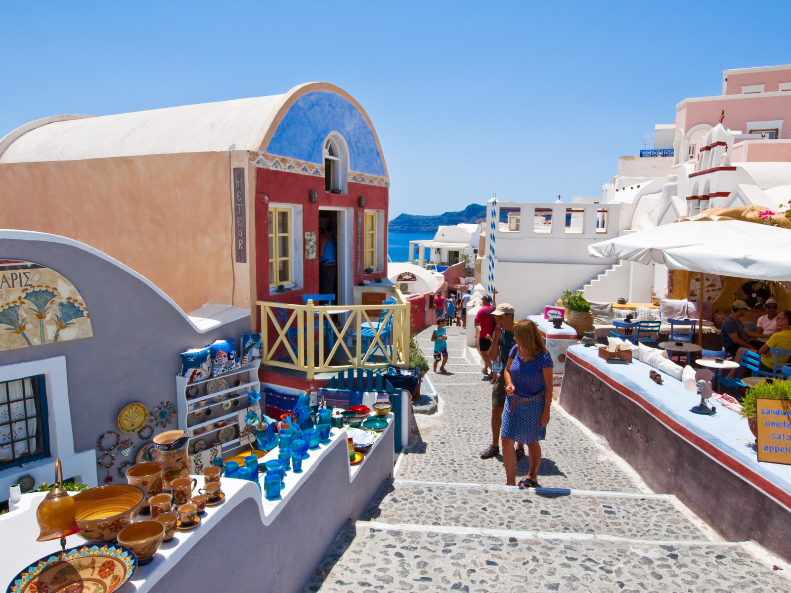 Image of a couple shopping in Santorini, one of the best things to do while there