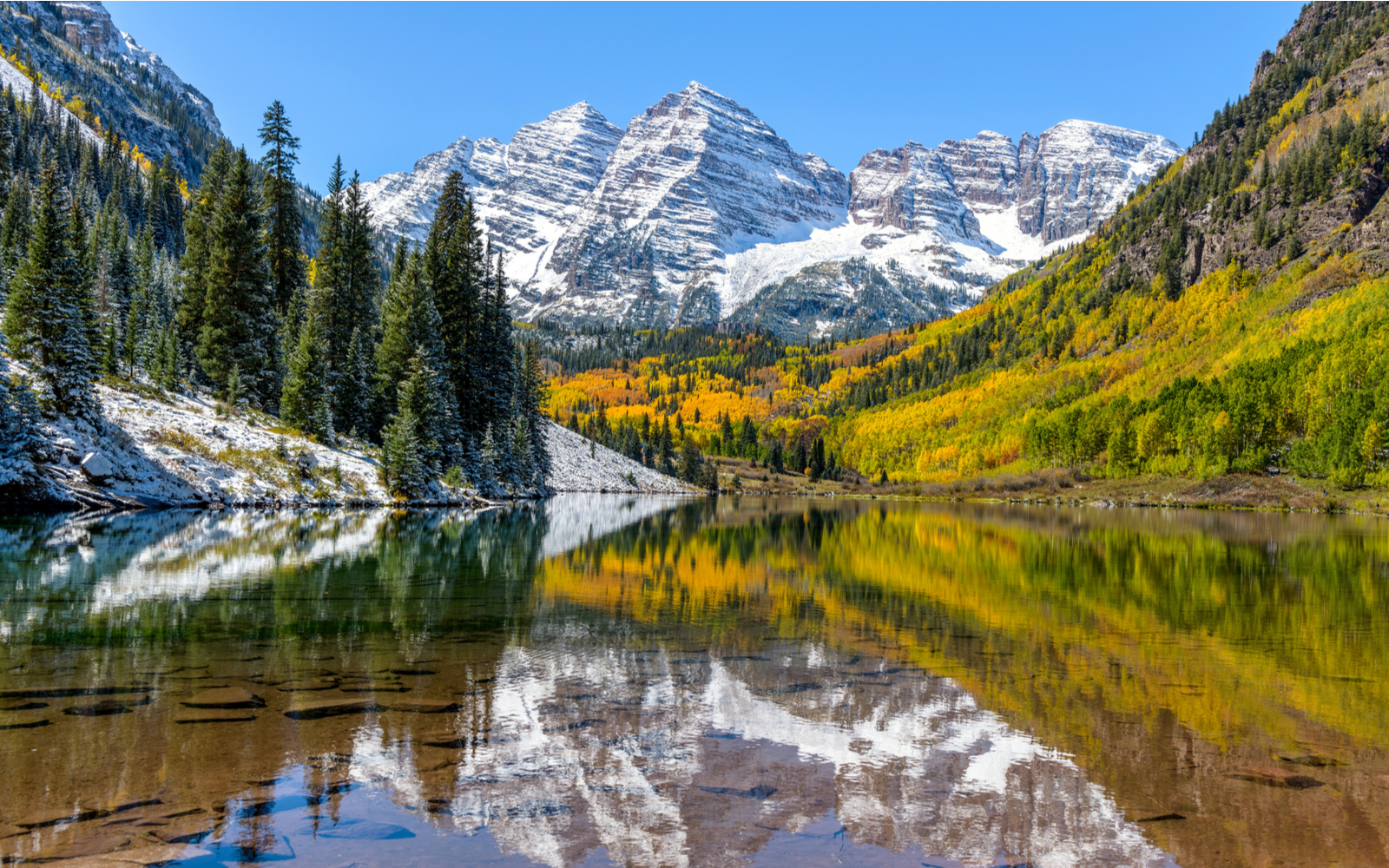 Marroon Lake pictured during the best time to visit Colorado, in the Spring or Fall
