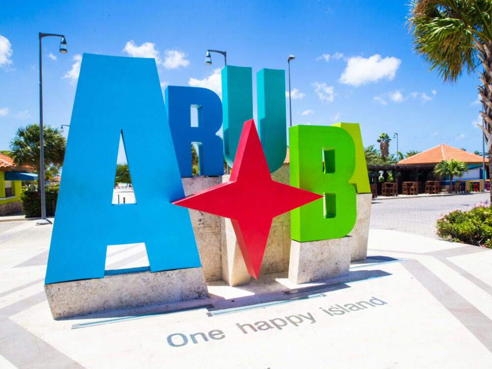 Colorful country sign pictured during the best time to visit Aruba