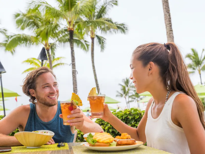 Couple on a Hawaiian vacation for a piece on the Best Restaurants in Hawaii