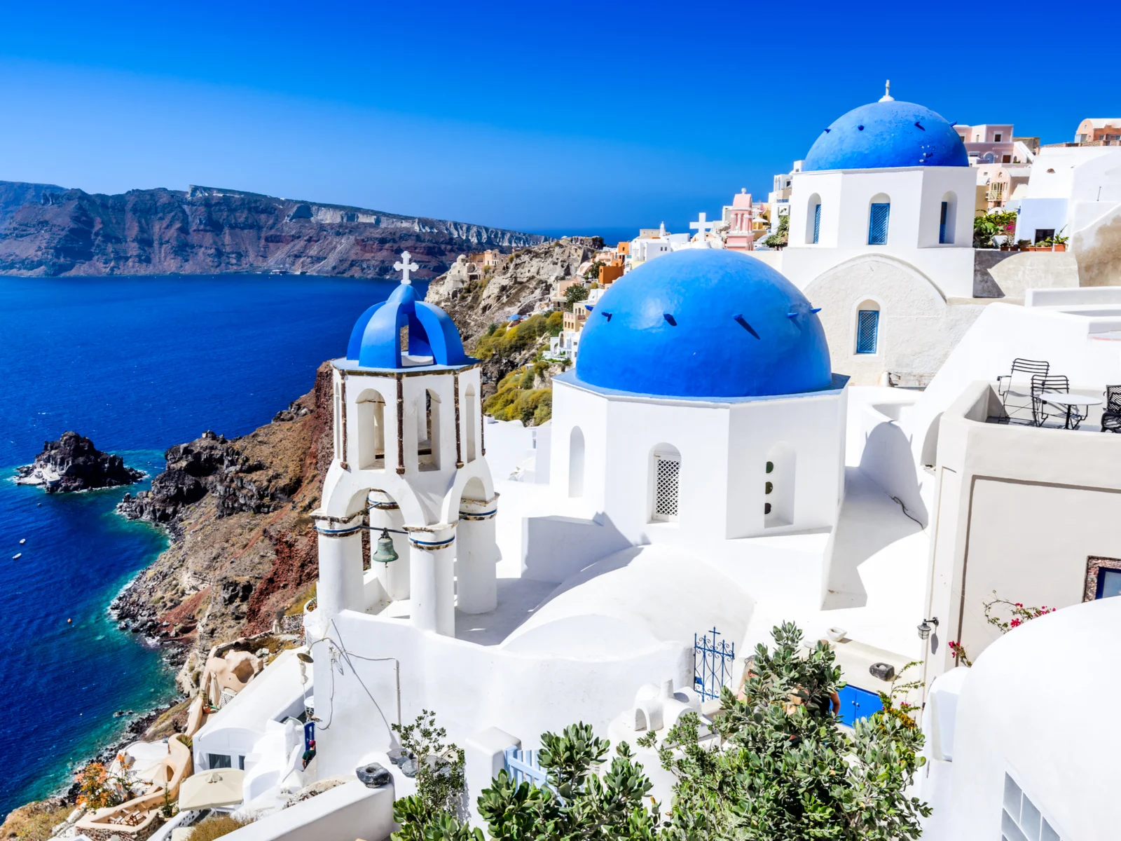 one of the best things to do in Santorini, to visit a blue-domed church
