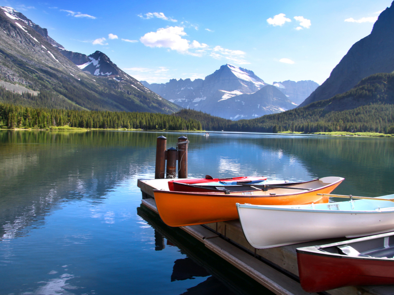 Canoes on Lake Glacier in one of the best national parks in the USA