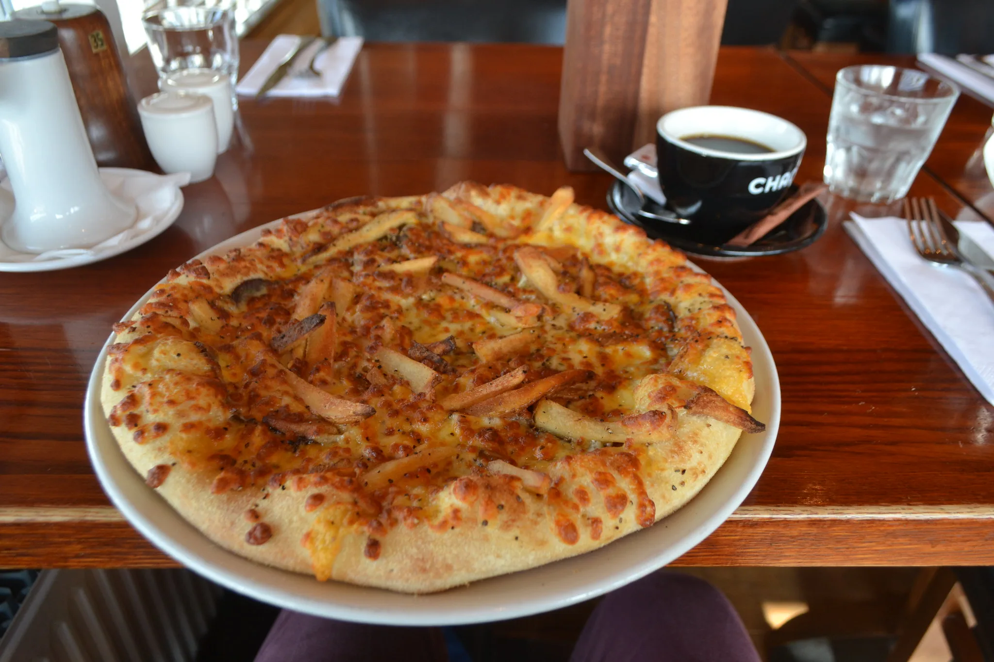 A serving of well-done Pizza Nautabanans with coffee at Greifinn, one of the best restaurants in Iceland