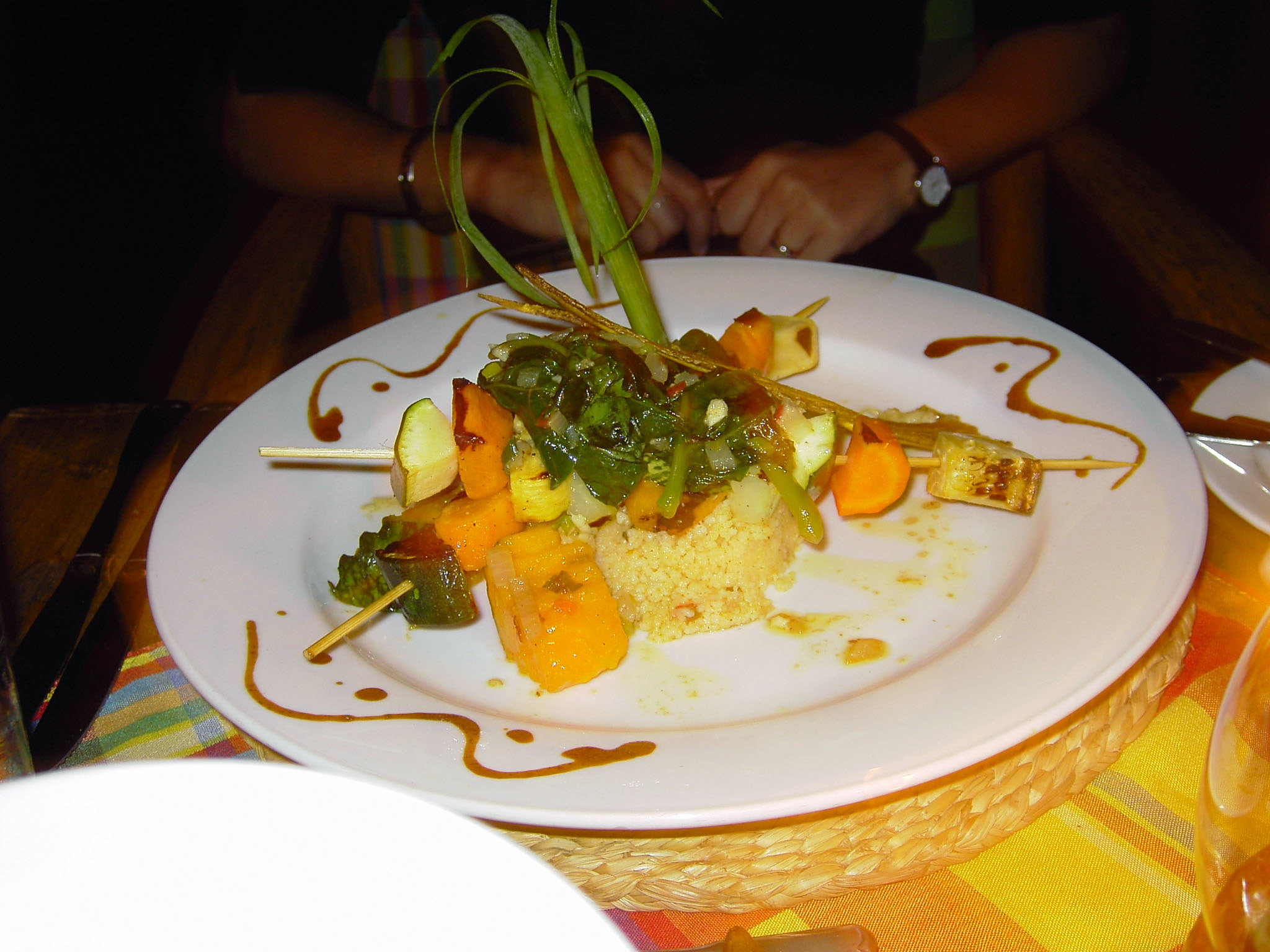 Fancy food plating at Dasheene in Ladera Resort, one of the best restaurants in St. Lucia, grilled vegetables and fruit skewers