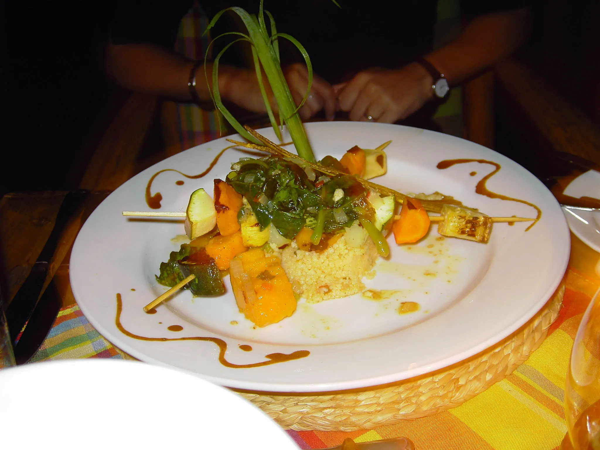 Fancy food plating at Dasheene in Ladera Resort, one of the best restaurants in St. Lucia, grilled vegetables and fruit skewers