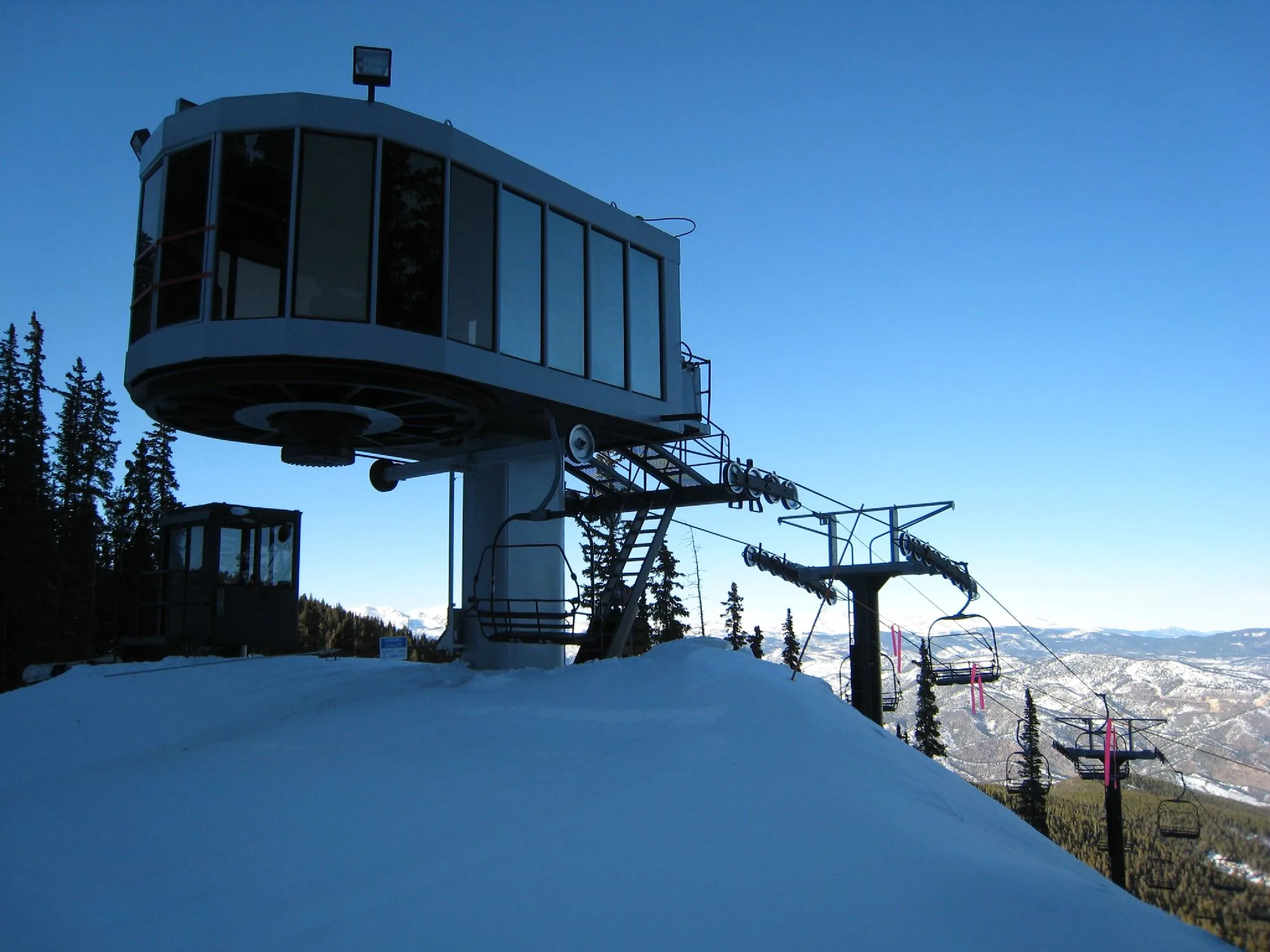 The top of a chairlift seen at the peak of a trail in Echo Mountain, one of the best ski resorts near Denver