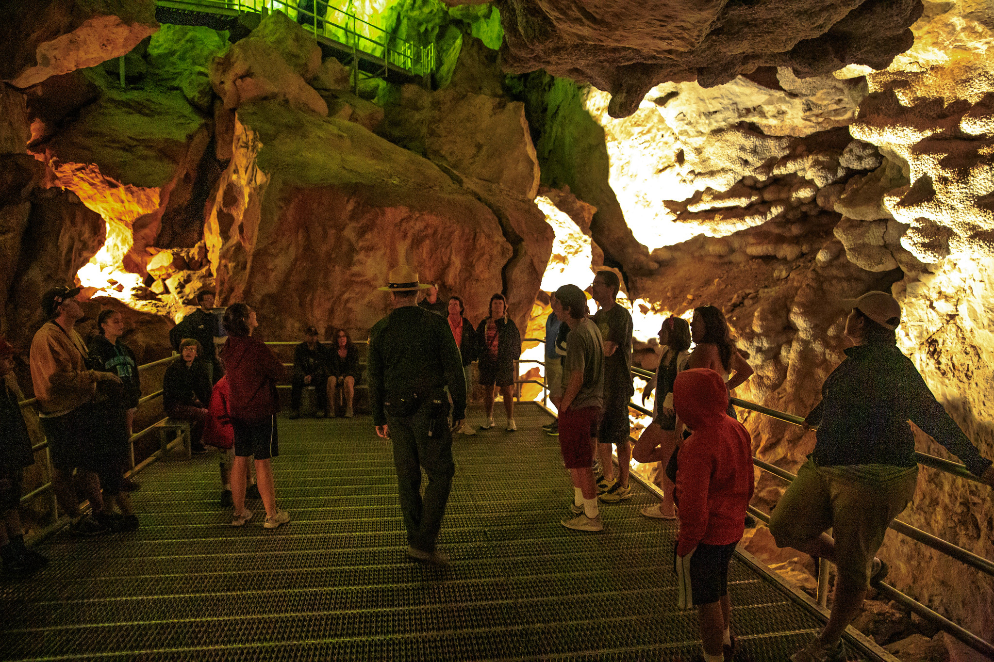 Tourists learning about the Jewel Cave National Monument, one of the best South Dakota tourist attractions, through a guide