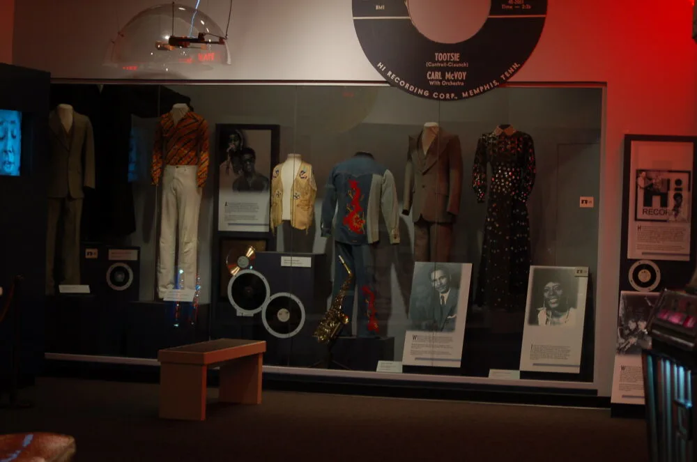 Set clothings and a saxophone which was once used by famous artists exhibited in Memphis Rock n Soul Museum, one of the best things to do in Tennessee