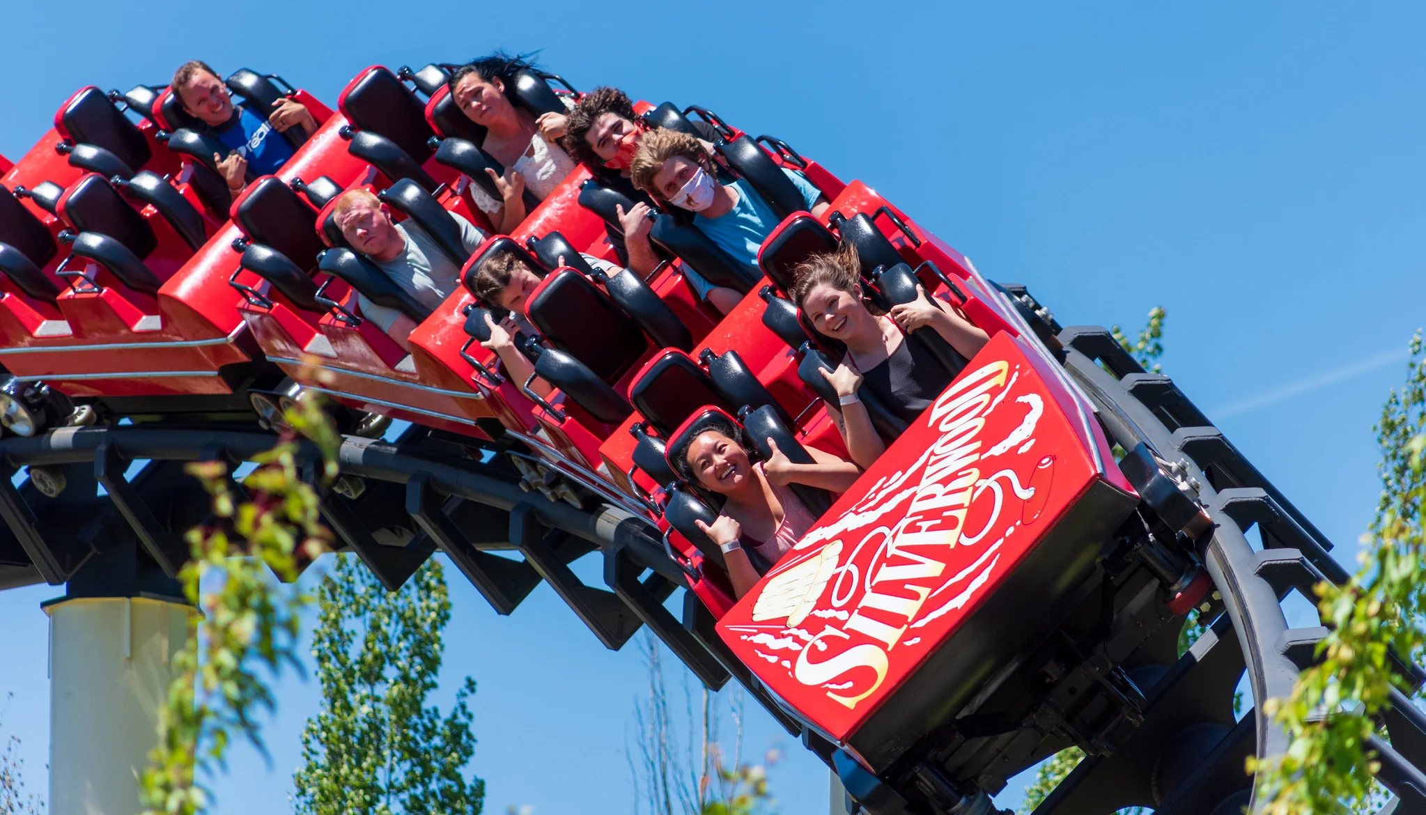 People enjoying the breathtaking red roller coaster at Silverwood Theme Park, one of the best things to see in Idaho