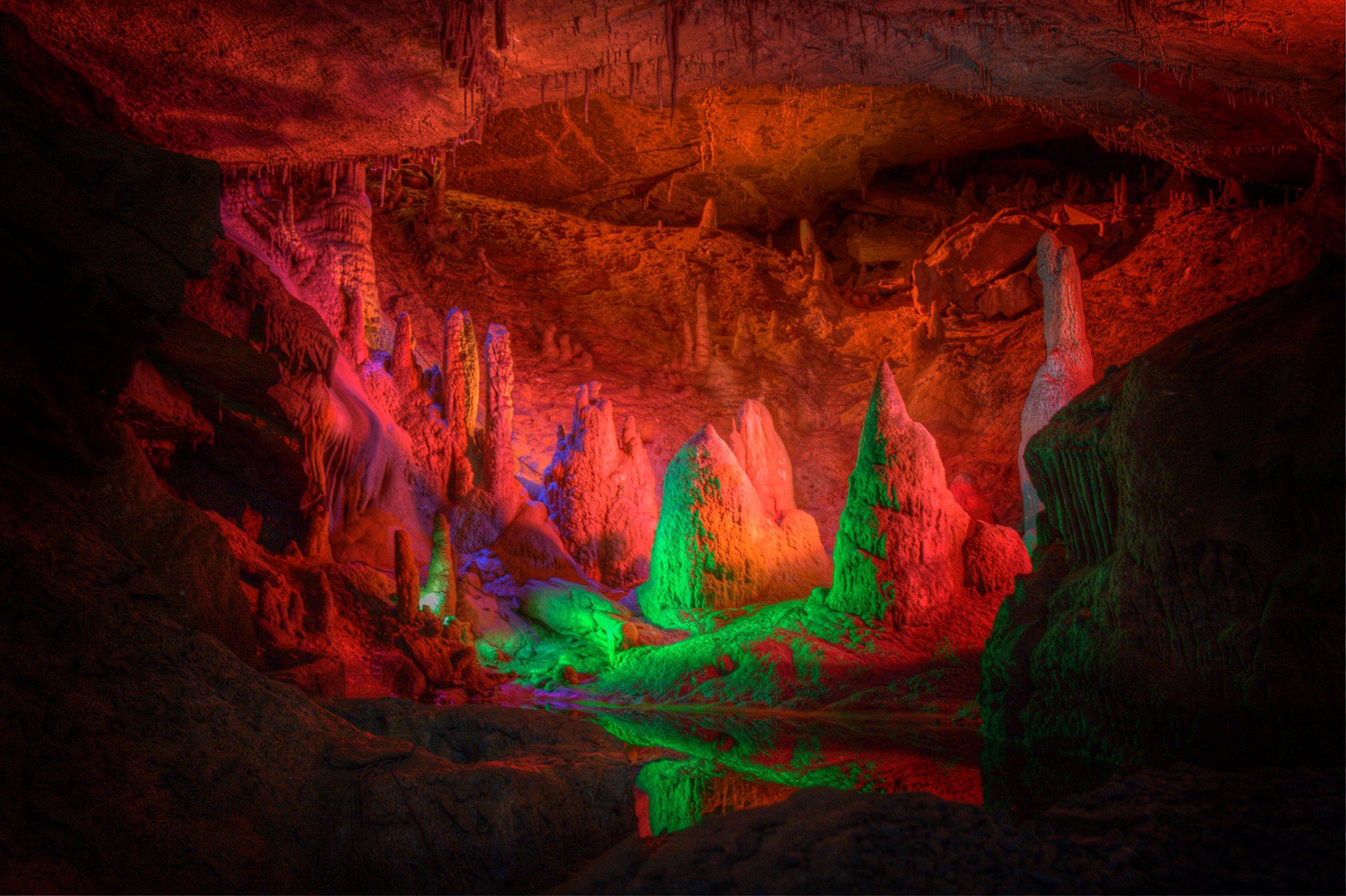 Inside of the Forbidden Caverns, one of the best things to do in Tennessee, rock formations are illuminated red and green