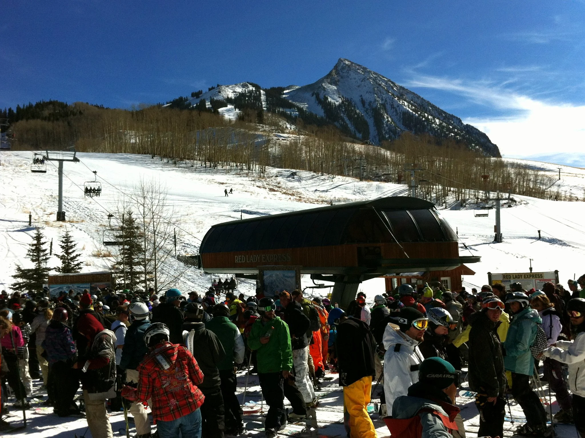 A busy day at Crested Butte Mountain Resort, one of the best ski resorts near Denver, where a large crowd waits for their turn on the chairlift