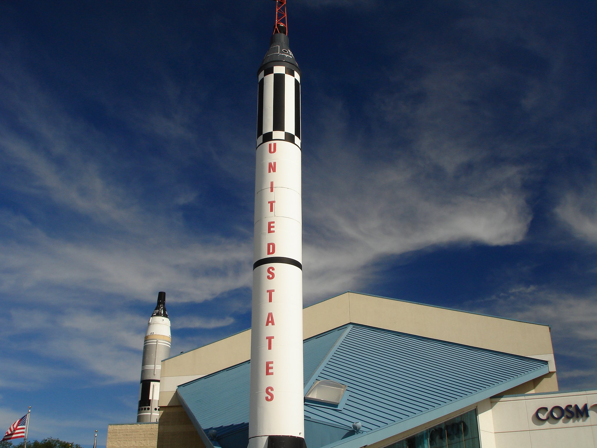 A dreamy sky over the tall Mercury Rocket at Cosmosphere, one of the best things to see in Kansas
