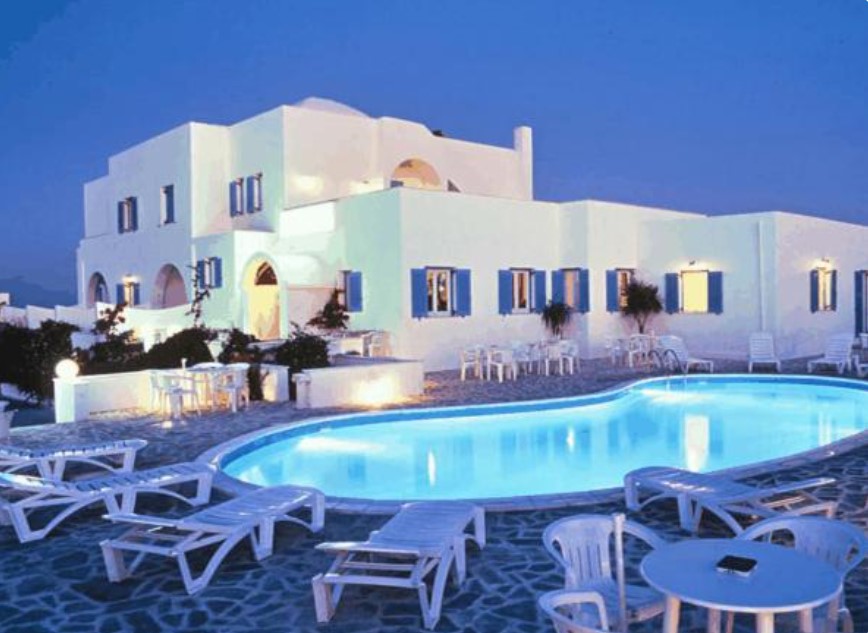 Babis Hotel, one of the best resorts in Santorini, pictured in the pool area in the evening
