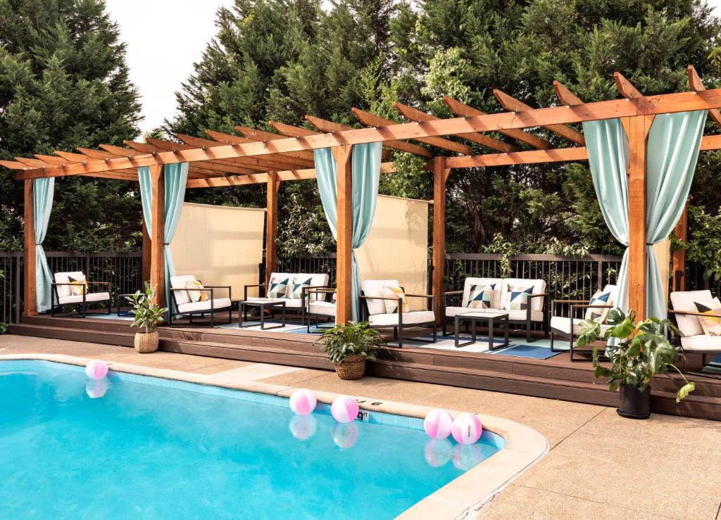 Hotel Preston Nashville Airport pool area with cabanas, one of the best hotels in Nashville
