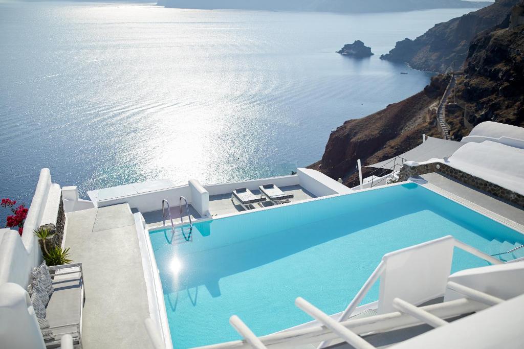 La Perla Villas and Suites, one of Santorini's best hotels, seen from the pool area overlooking the ocean