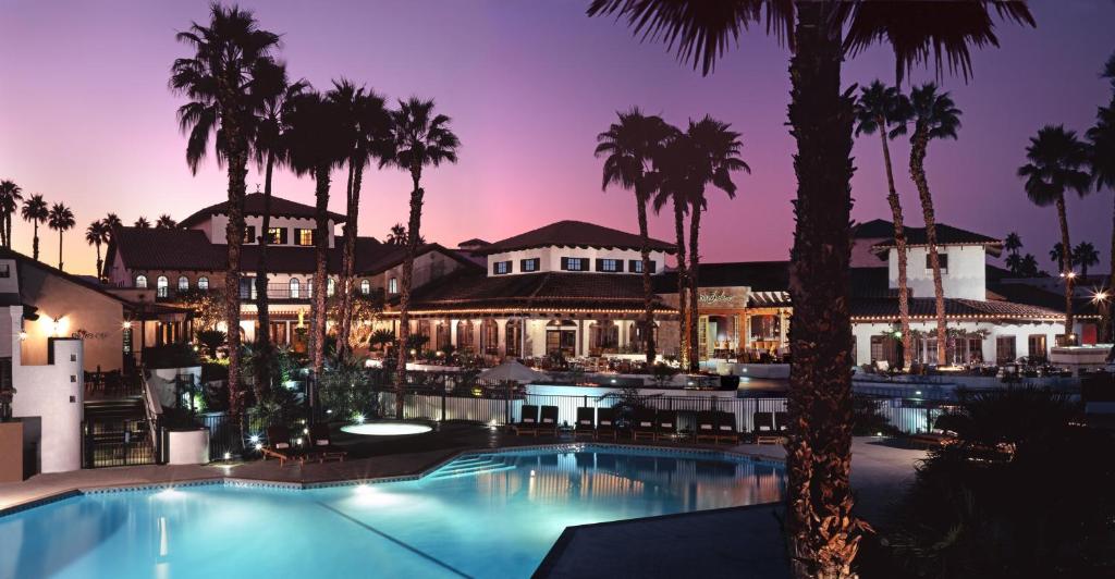 Night photo of one of our top picks for the best hotel in Palm Springs, the Omni Rancho Las Palmas Resort and Spa