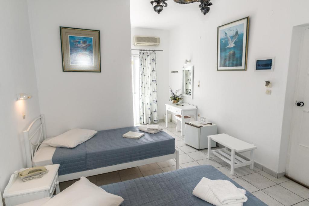 Room at the Asimina Hotel, one of the best hotels in Santorini, with two full beds