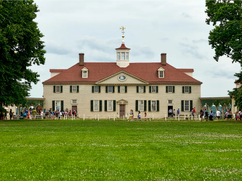 Tourist coming in and out of George Washington's historic home, one of the things to do in Virginia, at Mount Vernon