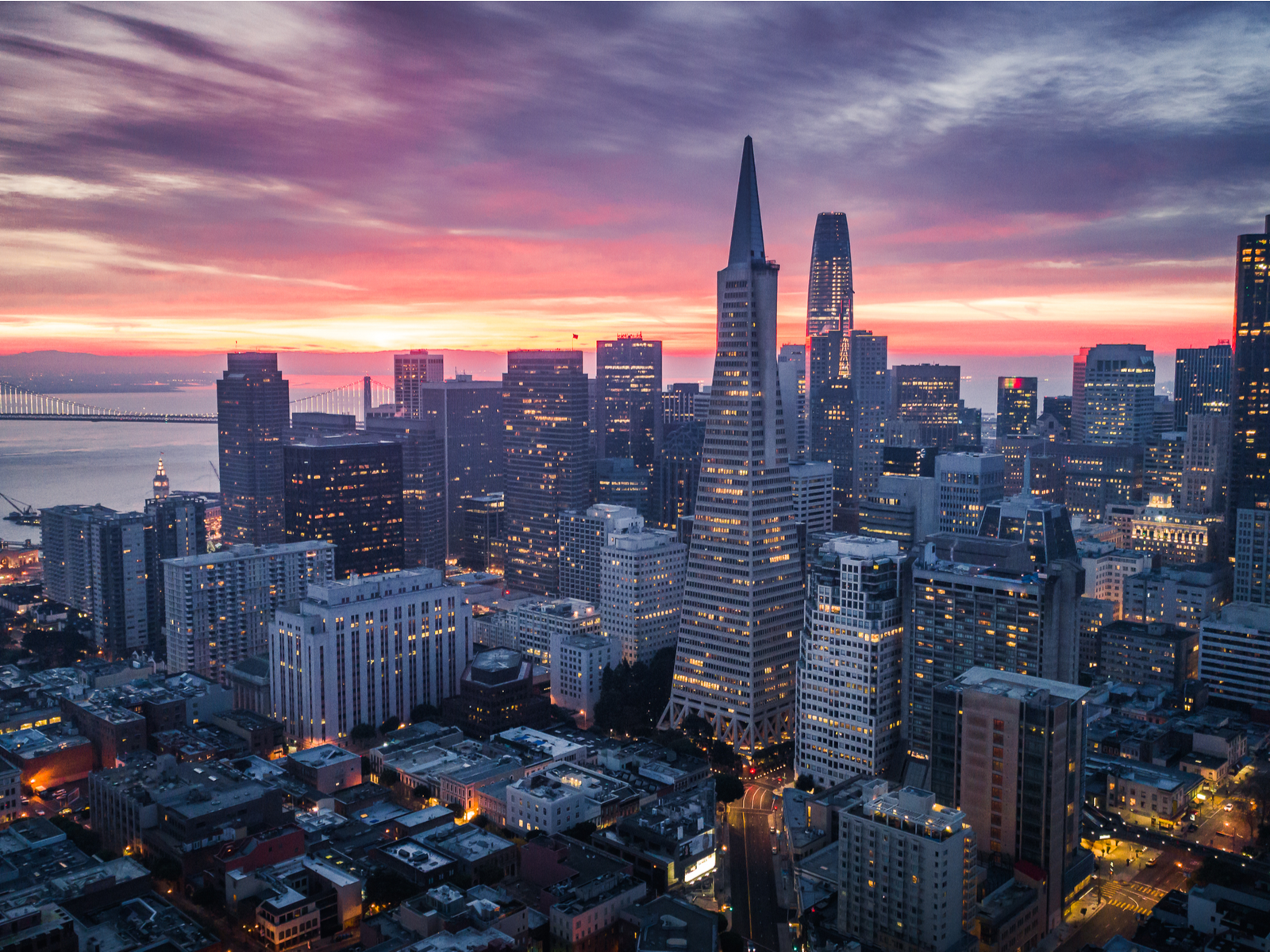 San Francisco skyline and dramatic sunset over city lights, a picture on the best places to visit in San Francisco