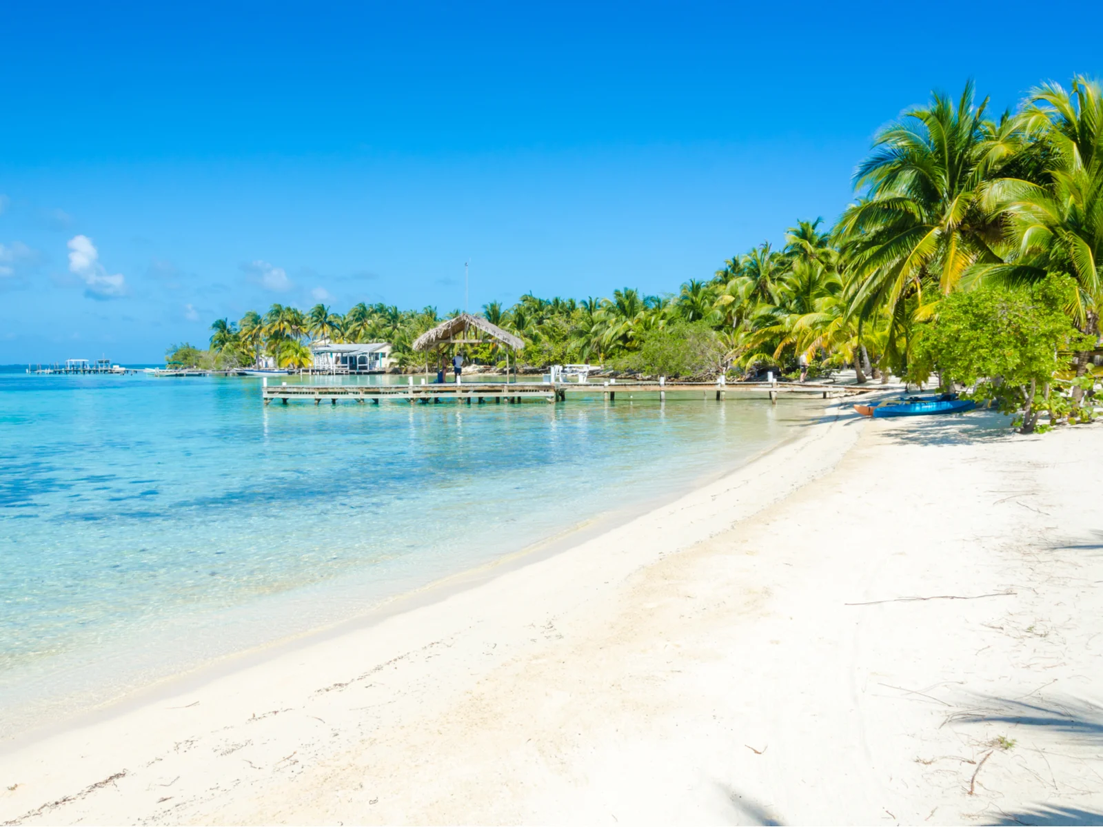 Belize Caye pictured during the best time to visit with white sand beaches and calm teal water
