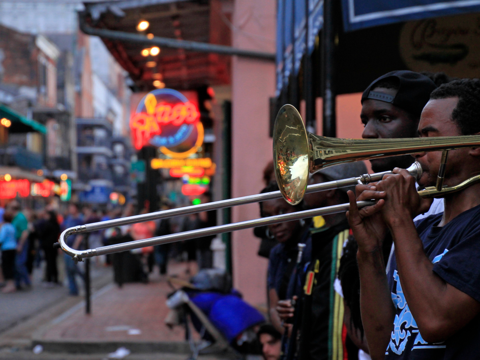 Live music played by a band on the street during the overall best time to visit New Orleans
