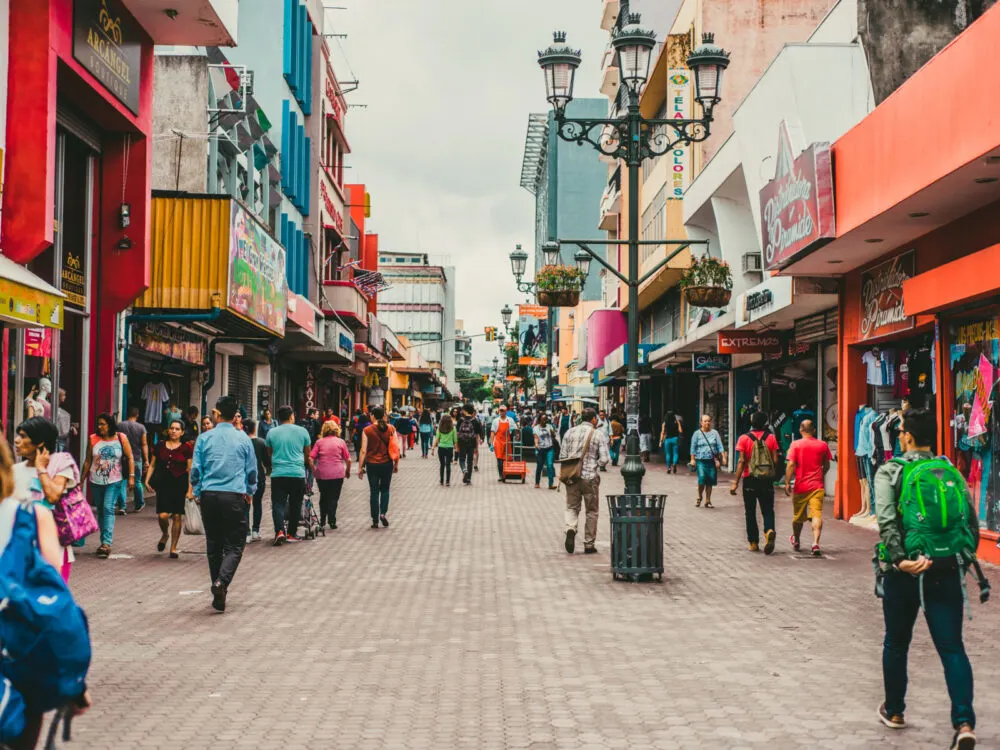 Image of people walking through a crowded town square in San Jose, one of the best things to do in Costa Rica