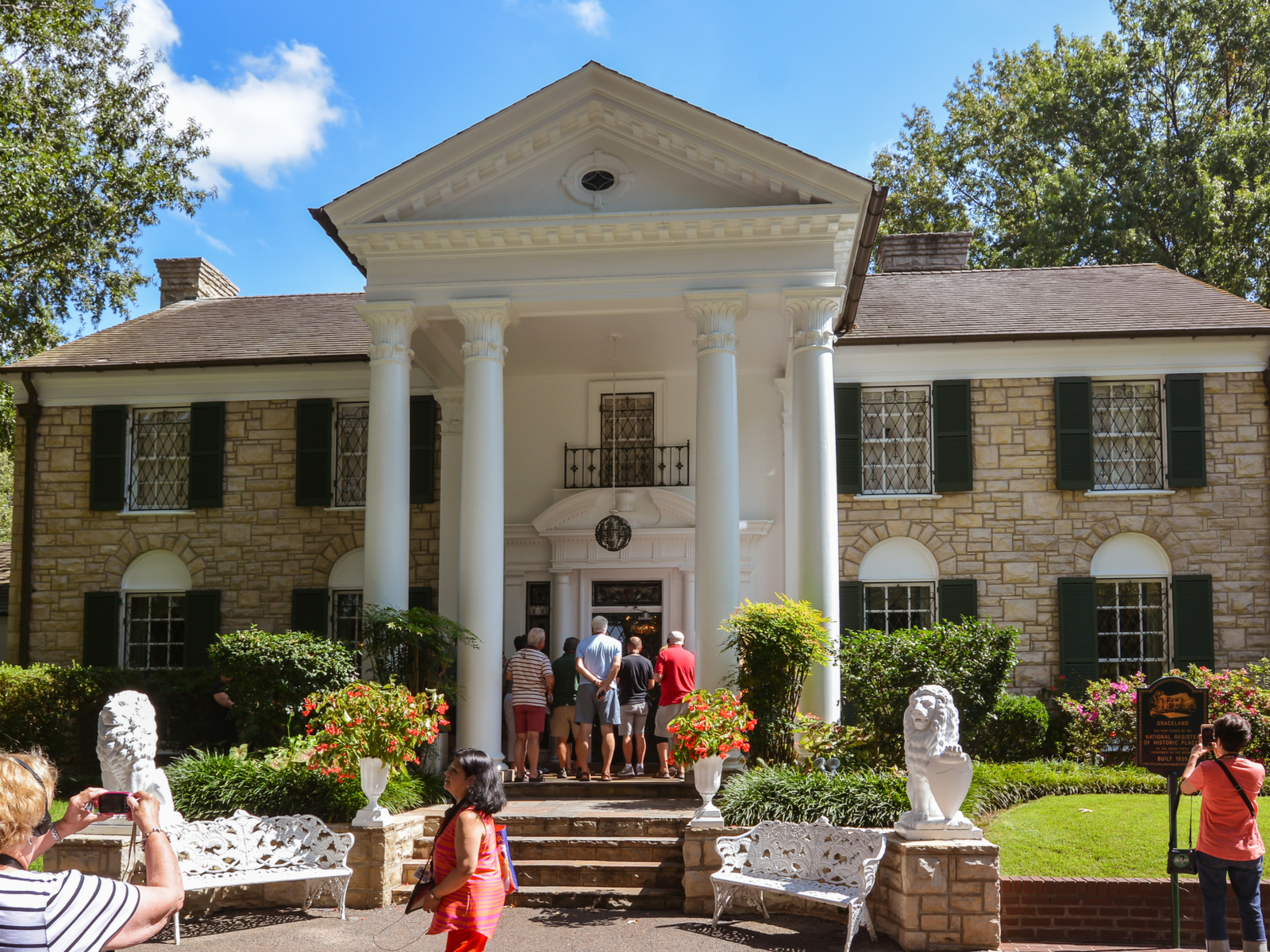 Several people gathered at the entrance of The Graceland Mansion, which was once an abode of the late Elves Presley and one of the best things to do in Tennessee