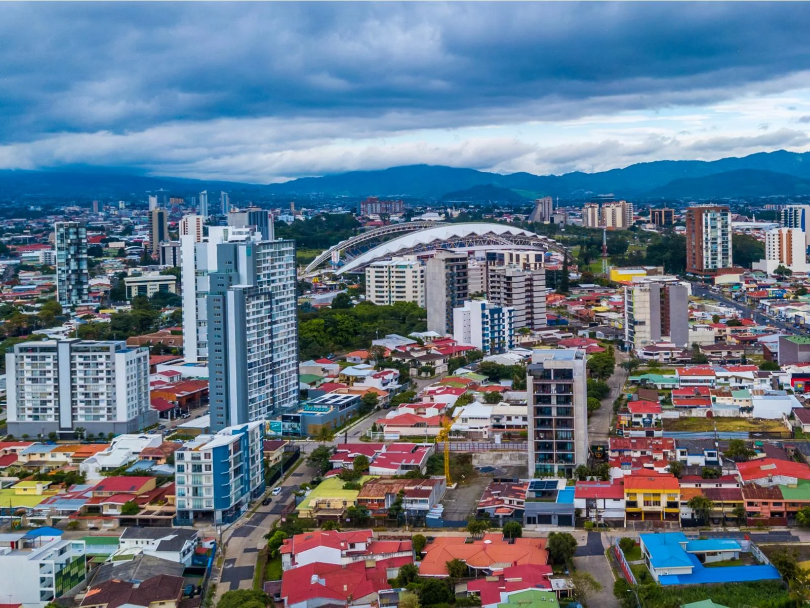Aerial view of the rich San Jose Downtown with its mountain skyline during an overcast day, one of the best things to do in Costa Rica