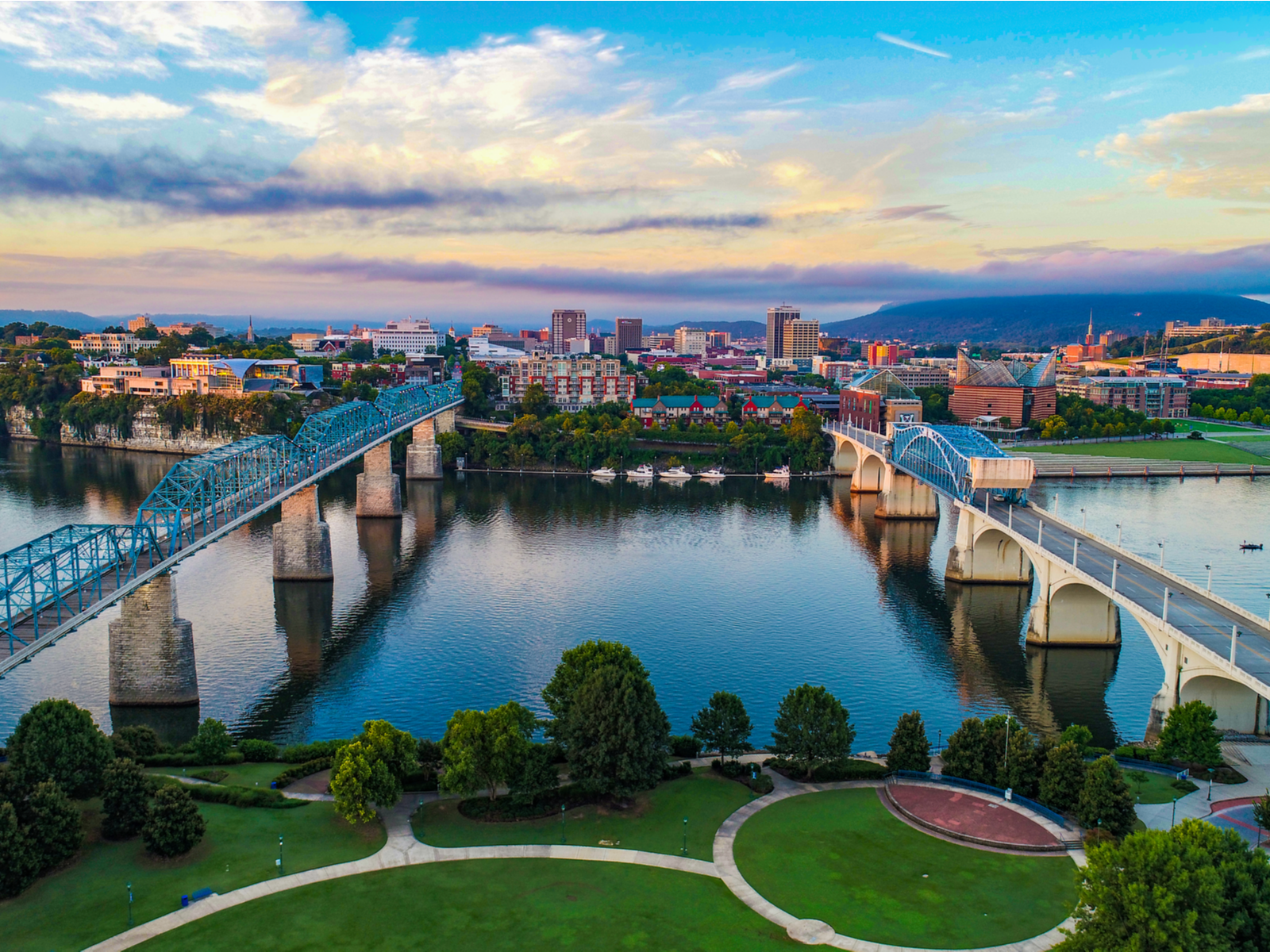 Chattanooga skyline's aerial view and the Market Street bridge spanning the great Tennessee River in a photo of the best places to visit in Tennessee