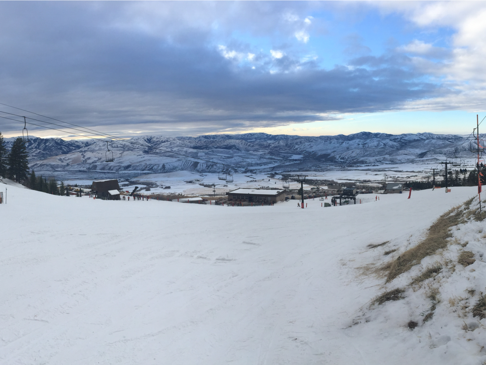 Sloppy landscape at Pebble Creek Ski Area, one of the best things to see in Idaho, with empty chairs lifts on Winter